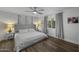 Cozy bedroom with a plush bed, stylish gray accents, and natural light from the window at 4228 N 87Th St, Scottsdale, AZ 85251