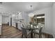 Bright dining area next to the kitchen with pool view, featuring a glass table and stylish gray chairs at 4228 N 87Th St, Scottsdale, AZ 85251