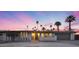 Charming single-story home featuring desert landscaping, a gray brick facade, and a private gated entrance at 4228 N 87Th St, Scottsdale, AZ 85251