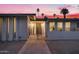 Inviting front entrance with metal gate detail and manicured gravel landscaping at 4228 N 87Th St, Scottsdale, AZ 85251