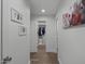 Hallway with updated flooring, fresh paint, and access to closets and other rooms at 4228 N 87Th St, Scottsdale, AZ 85251