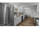 Modern kitchen featuring white cabinets, stainless steel appliances, and modern countertops at 4228 N 87Th St, Scottsdale, AZ 85251