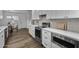 Modern kitchen with white cabinets, stainless steel appliances, quartz countertops at 4228 N 87Th St, Scottsdale, AZ 85251