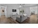 Living room boasts modern decor, wood floors, and sliding glass doors to the backyard at 4228 N 87Th St, Scottsdale, AZ 85251