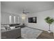 Spacious living area with cozy sectional sofa, stylish rug, and recessed lighting at 4228 N 87Th St, Scottsdale, AZ 85251