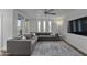 Comfortable living room showcasing modern furniture, a ceiling fan, and large windows at 4228 N 87Th St, Scottsdale, AZ 85251