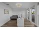 Bright office boasts wood floors, a modern desk, neutral color palette, and large windows at 4228 N 87Th St, Scottsdale, AZ 85251