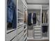 This walk-in closet features custom shelves, drawers, and ample space for clothing and accessories at 4228 N 87Th St, Scottsdale, AZ 85251