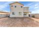 Spacious dirt backyard featuring a block wall fence and view of the home at 4234 S 62Nd Ln, Phoenix, AZ 85043
