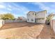 Spacious dirt backyard featuring a block wall fence surrounding the yard with an exterior view of the home at 4234 S 62Nd Ln, Phoenix, AZ 85043