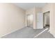 Bedroom features carpet, neutral paint, closet with mirrored doors and an en suite bathroom at 4234 S 62Nd Ln, Phoenix, AZ 85043