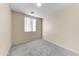 Bedroom features neutral walls, carpeted floor, and a window with blinds at 4234 S 62Nd Ln, Phoenix, AZ 85043