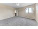 Bedroom with carpet and a window showing a landscape view at 4234 S 62Nd Ln, Phoenix, AZ 85043