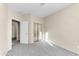 Neutral bedroom with mirror closet doors and access to attached room at 4234 S 62Nd Ln, Phoenix, AZ 85043