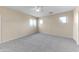 Bright bedroom with multiple windows and gray carpet at 4234 S 62Nd Ln, Phoenix, AZ 85043