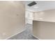 Carpeted upstairs hallway features neutral walls, white trim, and ample lighting at 4234 S 62Nd Ln, Phoenix, AZ 85043