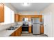 Kitchen includes stainless steel appliances, wood cabinets, and a light countertop at 4234 S 62Nd Ln, Phoenix, AZ 85043