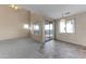 Open concept living room featuring neutral carpeting and vinyl flooring in the dining area at 4234 S 62Nd Ln, Phoenix, AZ 85043