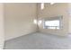 Inviting living room featuring neutral carpeting, high ceilings and lots of natural light at 4234 S 62Nd Ln, Phoenix, AZ 85043