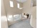 Spacious carpeted living room with high ceilings and plenty of natural light at 4234 S 62Nd Ln, Phoenix, AZ 85043
