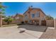 Rear exterior featuring a patio, block fence, and a lawn area at 439 N Cobblestone St, Gilbert, AZ 85234