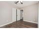 Bedroom featuring dark wood flooring, neutral walls, and a closet at 439 N Cobblestone St, Gilbert, AZ 85234