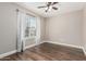 Bright bedroom with wood floors and a window overlooking a tree at 439 N Cobblestone St, Gilbert, AZ 85234