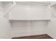 Walk-in closet with custom built-in shelving and racks for organized storage at 439 N Cobblestone St, Gilbert, AZ 85234