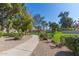 Picturesque community path lined with mature trees and landscaping, perfect for leisurely strolls at 439 N Cobblestone St, Gilbert, AZ 85234
