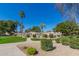 Inviting community pool area surrounded by palm trees, lush landscaping, and pedestrian walkways at 439 N Cobblestone St, Gilbert, AZ 85234