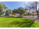 Expansive green space with mature trees, offering a serene and park-like setting for residents at 439 N Cobblestone St, Gilbert, AZ 85234
