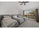 Spacious bedroom with multiple twin beds and an exterior balcony view at 4446 E Camelback Rd # 104, Phoenix, AZ 85018