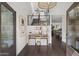 Charming foyer with views to the living and dining area features dark wood floors and modern finishes at 4446 E Camelback Rd # 104, Phoenix, AZ 85018