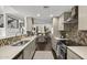 Modern kitchen with stainless steel appliances and eat in dining area and views to the living room at 4446 E Camelback Rd # 104, Phoenix, AZ 85018