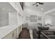 Bright loft features built-in storage, daybed, dark wood floors, and stylish decor at 4446 E Camelback Rd # 104, Phoenix, AZ 85018