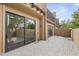 Outdoor patio with sliding glass doors and a tile floor at 4446 E Camelback Rd # 104, Phoenix, AZ 85018