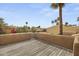 Outdoor patio with wood floors and mature landscaping at 4446 E Camelback Rd # 104, Phoenix, AZ 85018