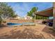 Backyard view showcases pool, patio, block fence offering privacy and outdoor entertaining space at 4604 E Summerhaven Dr, Phoenix, AZ 85044