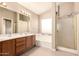 Bathroom featuring a shower, bathtub, and double sinks at 4604 E Summerhaven Dr, Phoenix, AZ 85044