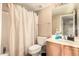 Bathroom featuring a shower with curtain, a toilet, and a vanity with a sink and mirror at 4604 E Summerhaven Dr, Phoenix, AZ 85044