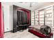 Bedroom with striped accent walls, a ceiling fan, hard surface floors, and closet shelving at 4604 E Summerhaven Dr, Phoenix, AZ 85044