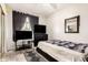 Bedroom featuring gray flooring, a ceiling fan, two televisions, and a sliding glass door at 4604 E Summerhaven Dr, Phoenix, AZ 85044