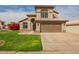 Charming two-story home with a well-maintained lawn, desert landscaping, and a spacious two-car garage at 4604 E Summerhaven Dr, Phoenix, AZ 85044