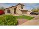 Charming two-story home featuring a well-manicured lawn, desert landscaping, and an attached two-car garage at 4604 E Summerhaven Dr, Phoenix, AZ 85044