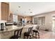 Bright kitchen with granite countertops, an island, stainless steel appliances and tile floors at 4604 E Summerhaven Dr, Phoenix, AZ 85044