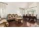 Elegant living room featuring hardwood floors, high ceilings, and bright natural light at 4604 E Summerhaven Dr, Phoenix, AZ 85044