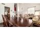 Elegant dining and living area showcasing high ceilings and lots of light at 4604 E Summerhaven Dr, Phoenix, AZ 85044