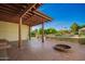 Spacious backyard with covered patio, pool view, and beautiful landscaping at 4612 W Waltann W Ln, Glendale, AZ 85306