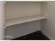 An empty closet with a wood floor and wall-mounted shelves at 4612 W Waltann W Ln, Glendale, AZ 85306