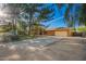 Spacious home with an attached garage and a long driveway, surrounded by mature trees at 4612 W Waltann W Ln, Glendale, AZ 85306